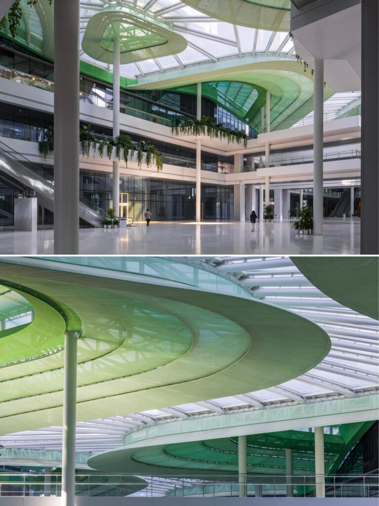 Technical detail of dual-layer ETFE air pillows and acoustic PTFE mesh for commercial atrium renovation